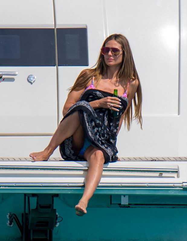 Heidi Klum Upskirt in Bikini on a Boat in Cannes.