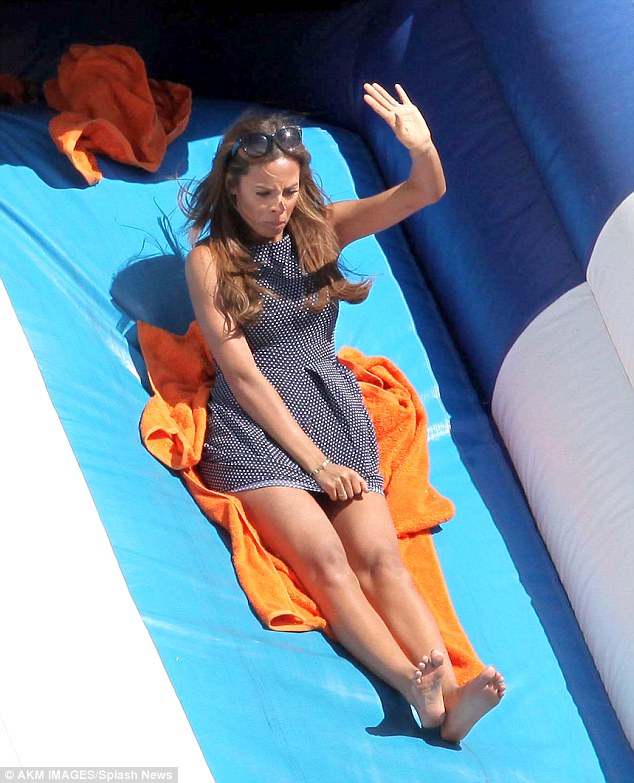 Rochelle Humes upskirt shows off her pants on slide.